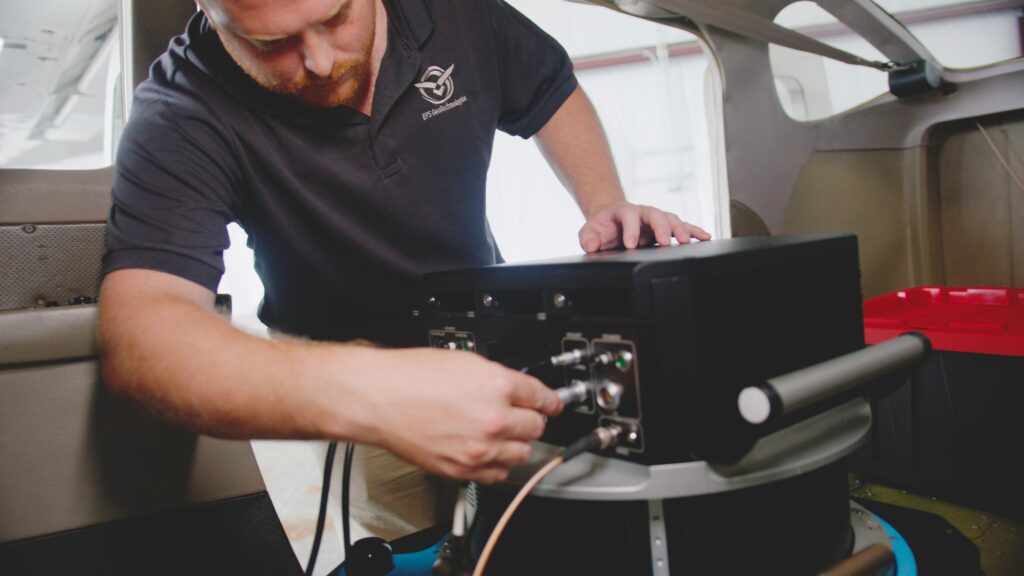 Pilot preparing PAS 880 system for GIS mapping missions in Little Rock.